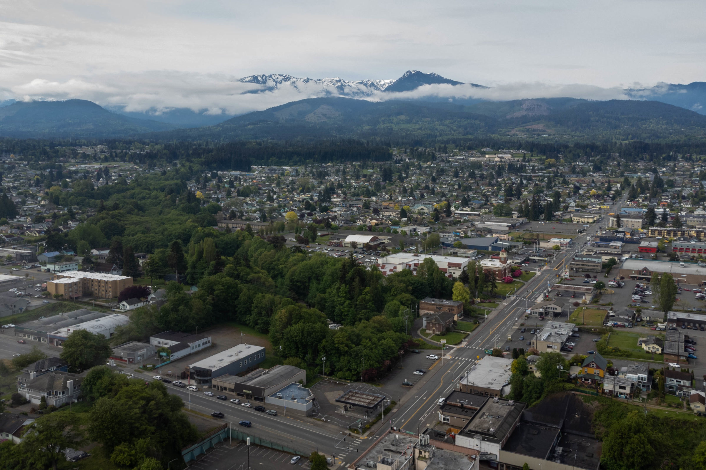 Aerial view of Port Angeles looking south over town streets and neighbourhoods toward the Olympic Mountains