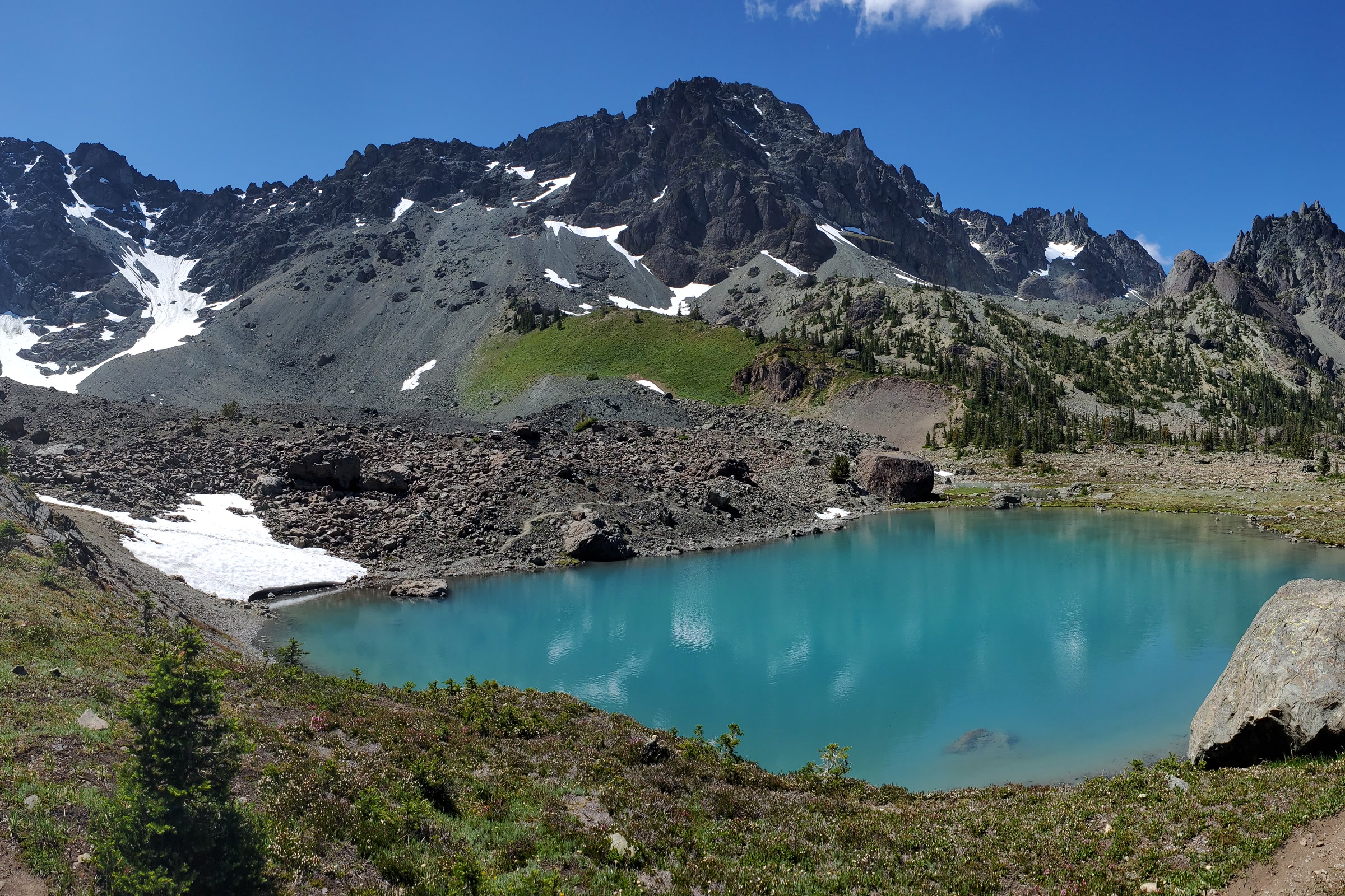 Turquoise Royal Lake in Royal Basin beneath the rocky ridges of Mount Deception and Martin Peak